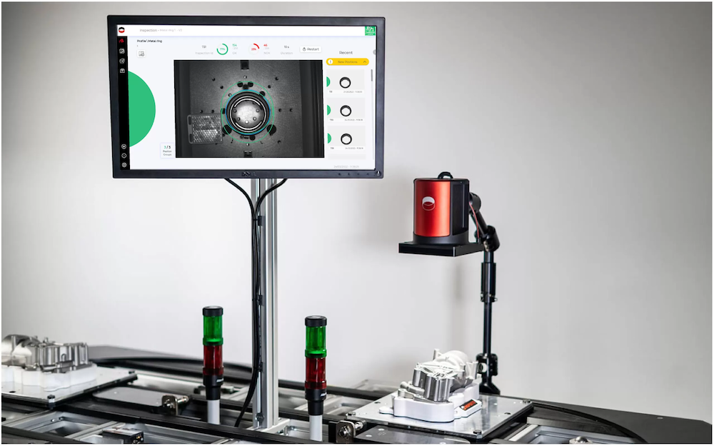 An INSPEKTO vision sensor connected to a monitor showing what the sensor sees.