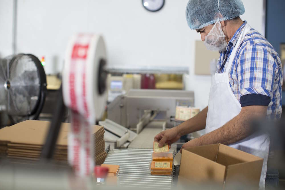 Worker on a manual packaging line