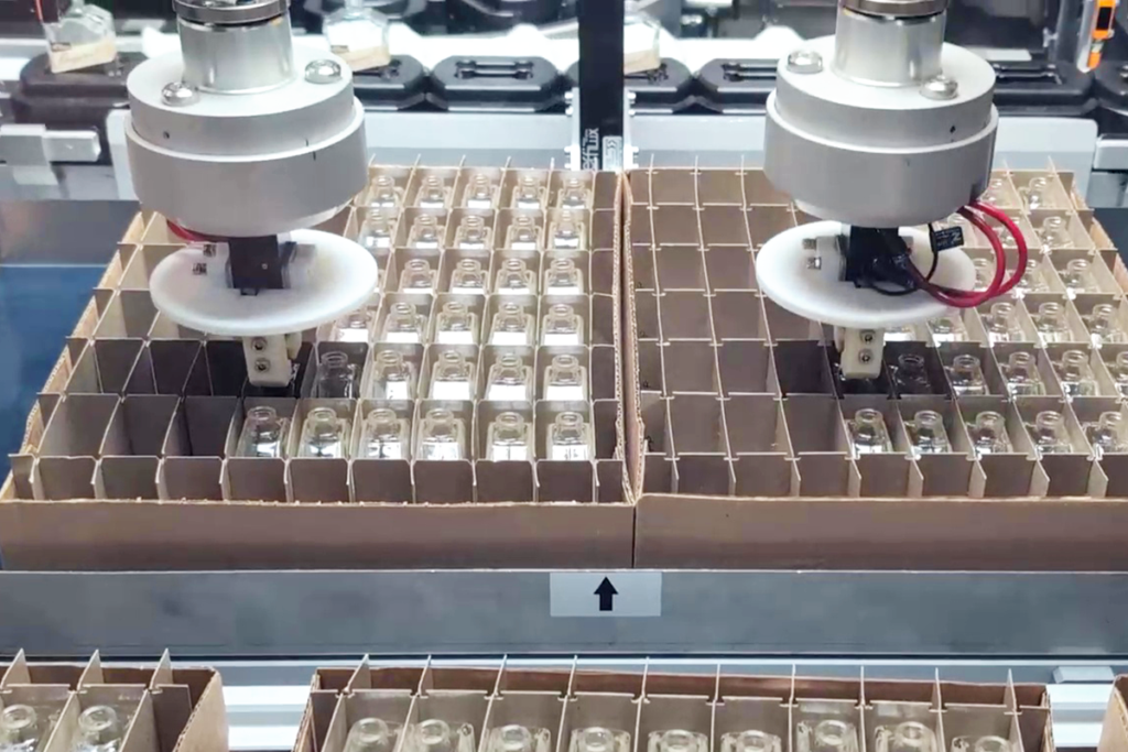 automated pick and place of perfume bottles