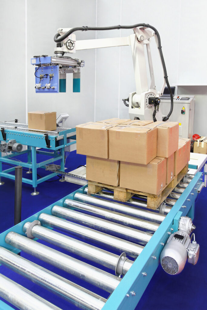Automated robotic palletizer for boxes at conveyor rollers