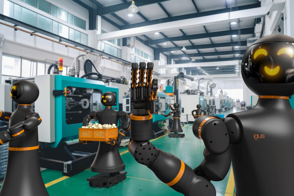 Multiple humanoid robots in an injection molding facility.